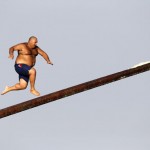 A man runs up the "gostra" during the religious feast of St Julian outside Valletta