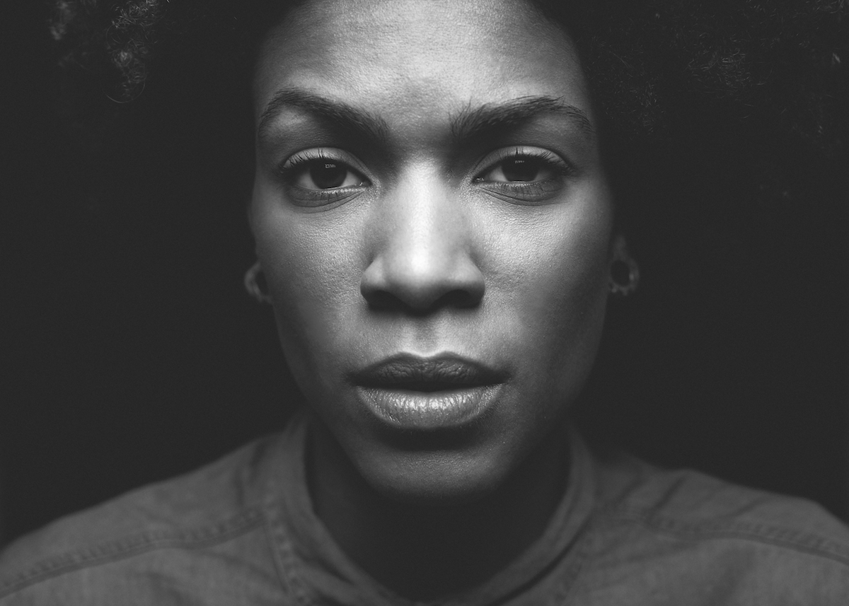 Woman face with deep eyes portrait, black and white photo session in